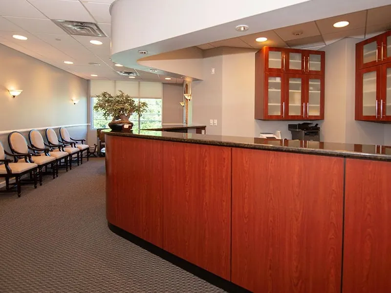 The reception desk and waiting chairs in Suite 201.